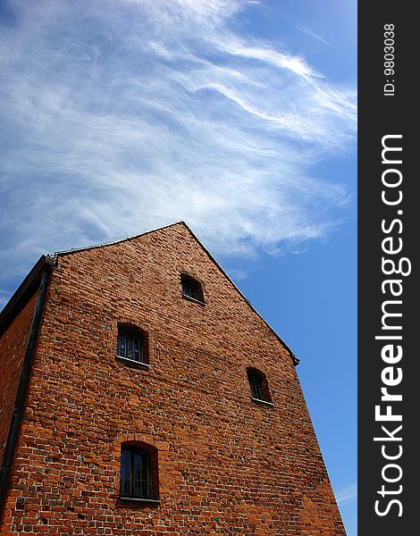 red-brick house in the clouds