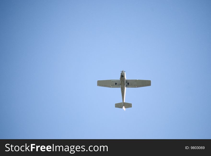 Small airplane in blue sky