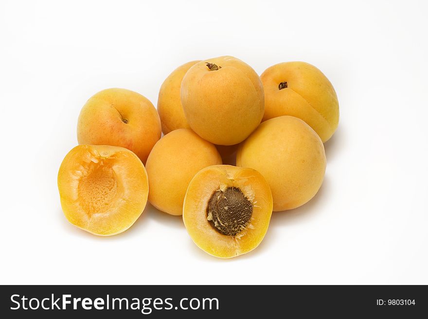 Yellow apricots isolated with white