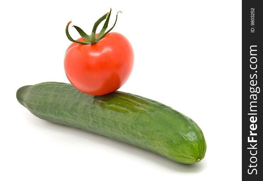 Cucumber and red tomato isolated on white background.