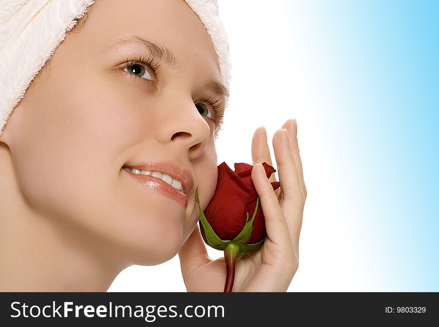 Beauty girl in towel with rose relaxing after shower on white background. Beauty girl in towel with rose relaxing after shower on white background