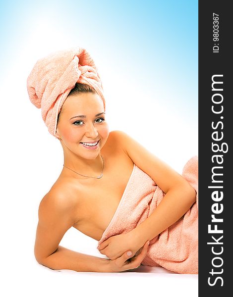 Spa young pretty girl in towel after shower on white background