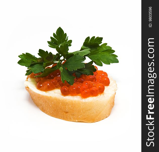 Red caviar on white bread, parsley on top. Red caviar on white bread, parsley on top