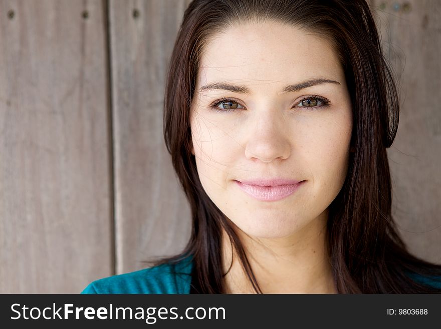 A Beautiful Brunette with fresh skin looking at camera