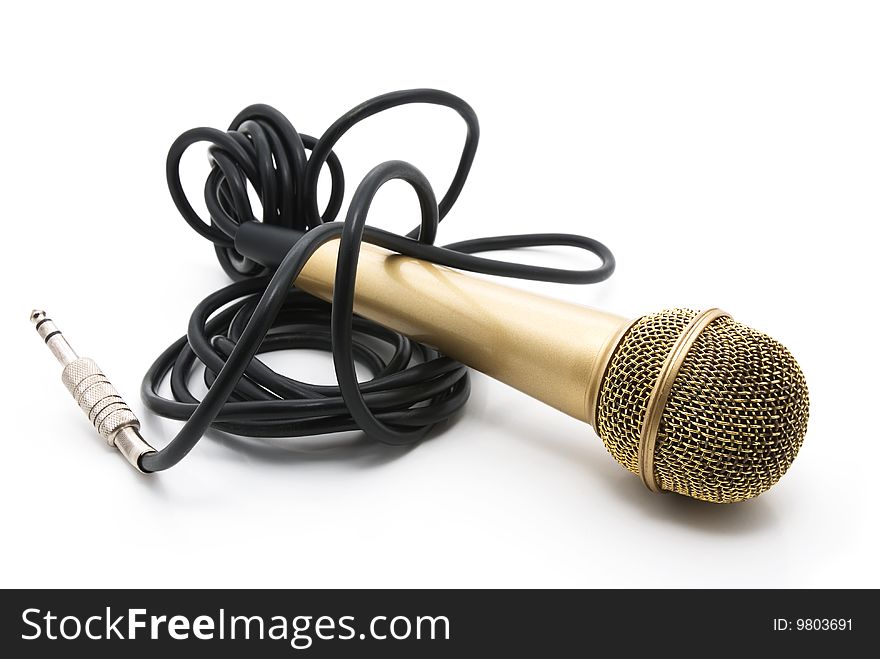 Old golden microphone with a black wire