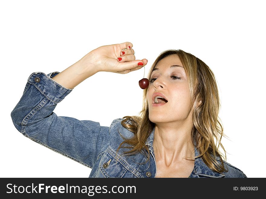 Beautiful woman with a cherry isolated on white