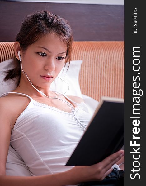 An image of an asian female student studying. An image of an asian female student studying