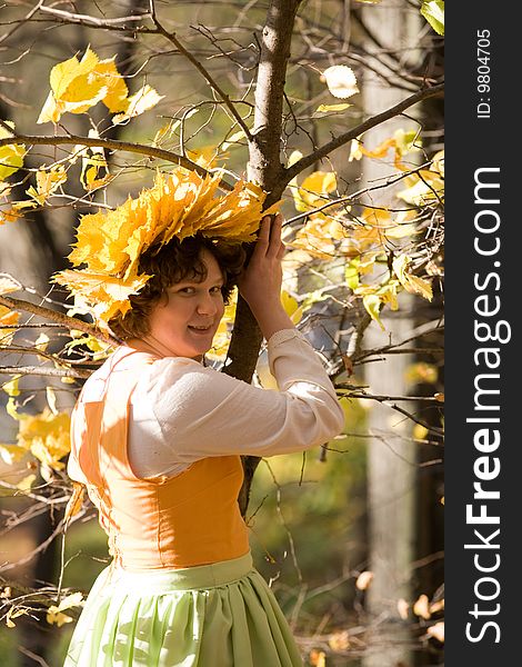 Woman in medieval dress in autumn forest. Woman in medieval dress in autumn forest