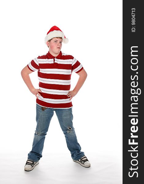 Annoyed Looking Teenage Boy In Santa Hat