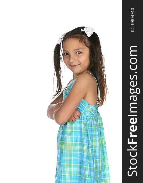 Cute multi racial girl grinning with arms crossed. Cute multi racial girl grinning with arms crossed