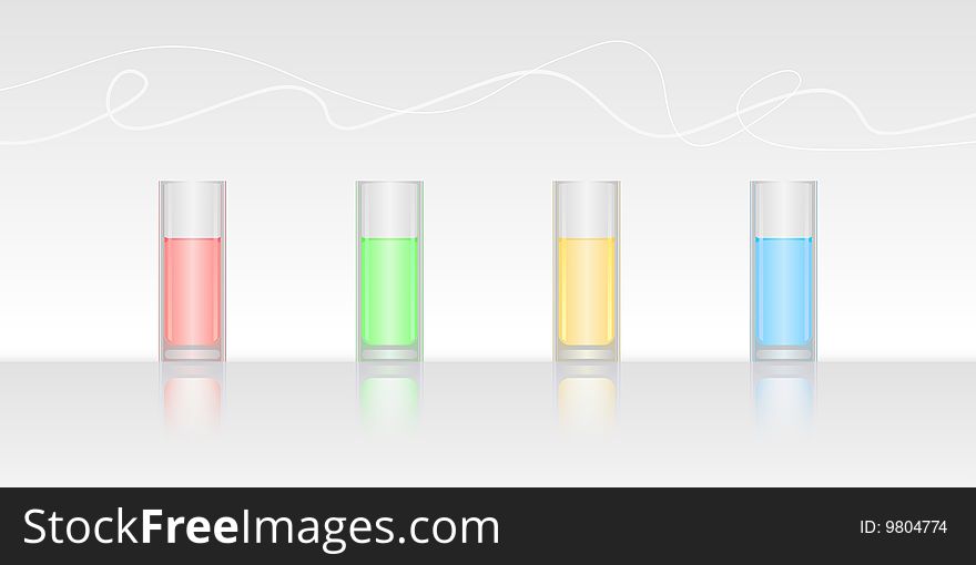Four glasses filled with colored water