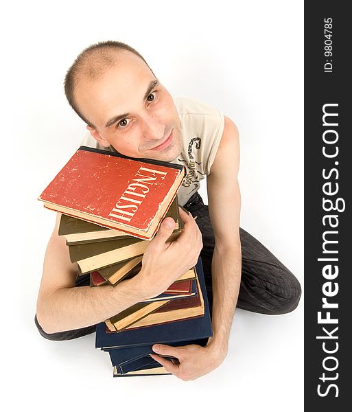Happy young man with books. Isolated on white