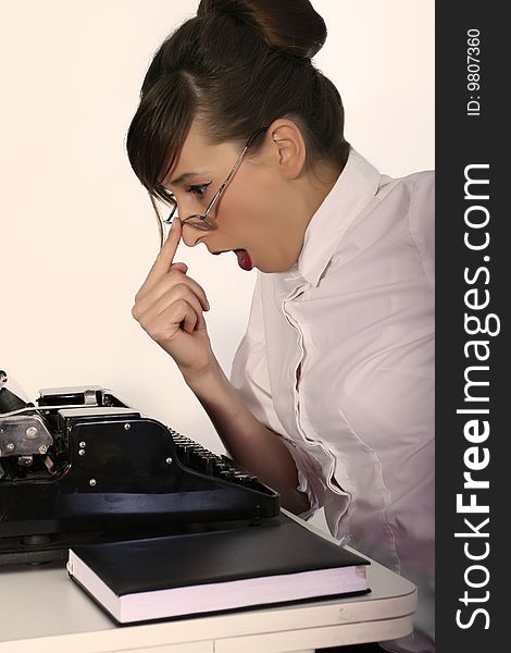 Retro business woman with vintage typewriter in stress. Retro business woman with vintage typewriter in stress