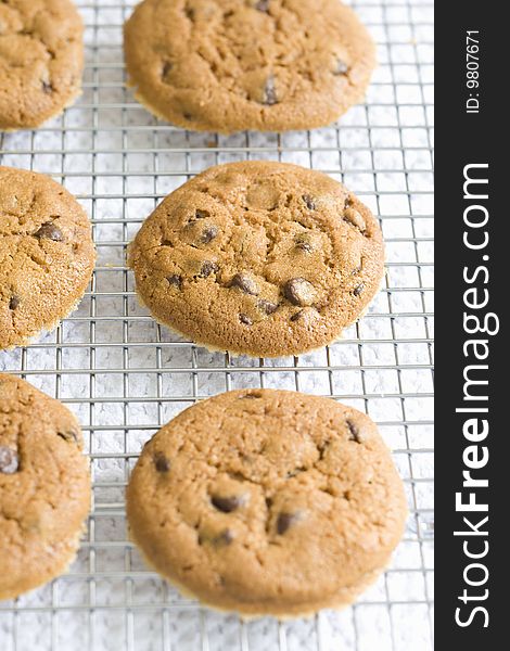 Chocolate chip cookies cooling on rack