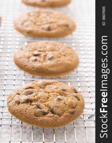 Chocolate chip cookies cooling on rack