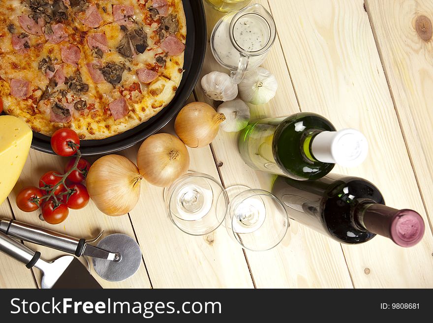 A couple of delicious pizzas, with raw tomatoes, green peppers and mushrooms. A couple of delicious pizzas, with raw tomatoes, green peppers and mushrooms