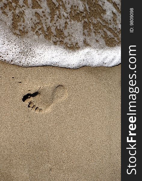 Footprint in the sand along the shore. Footprint in the sand along the shore