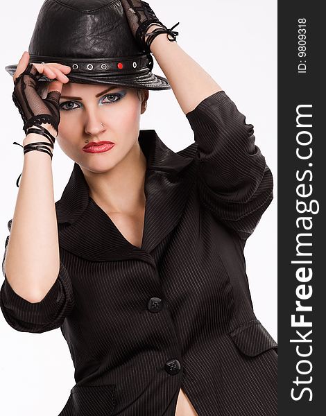 Young fashionable model with black hat