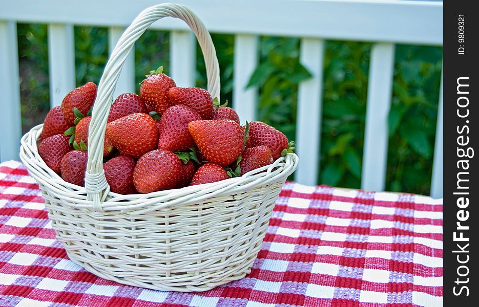 Summer strawberries in a wicker basket. Summer strawberries in a wicker basket.