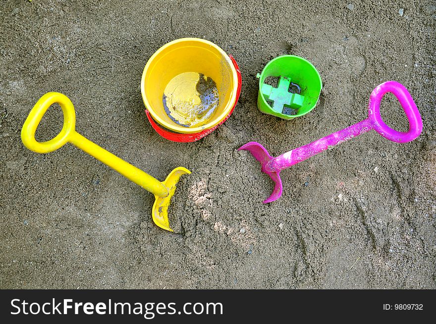 Two shovels and two buckets on sand. Two shovels and two buckets on sand.