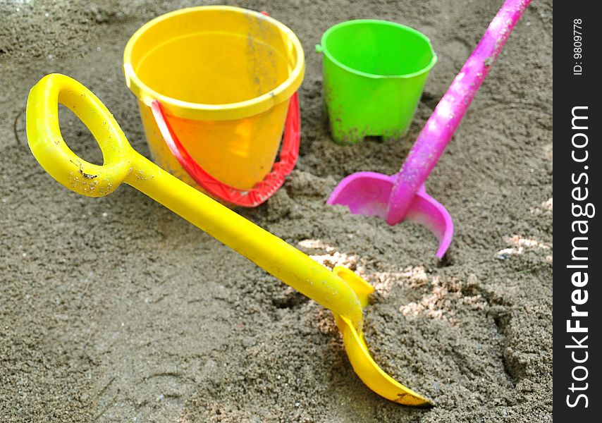 Shovels and buckets, toys on sand. Shovels and buckets, toys on sand