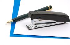 Black Stapler And Blue Folder Royalty Free Stock Photo