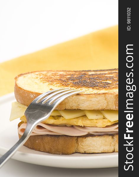 Tasty sandwich of ham and cheese omelet isolated