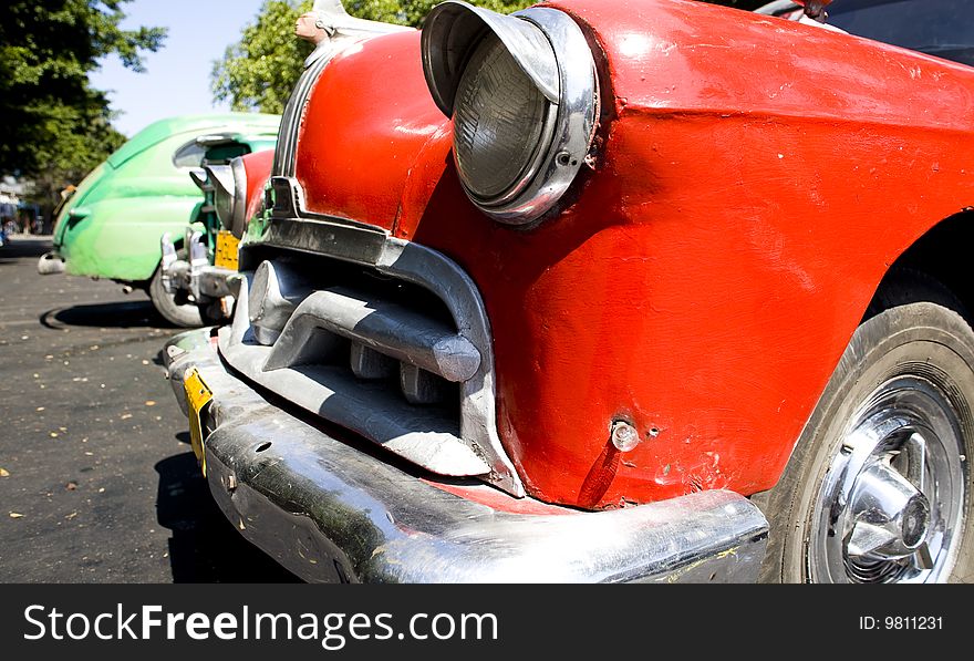 Old style red car on the streets of cuba