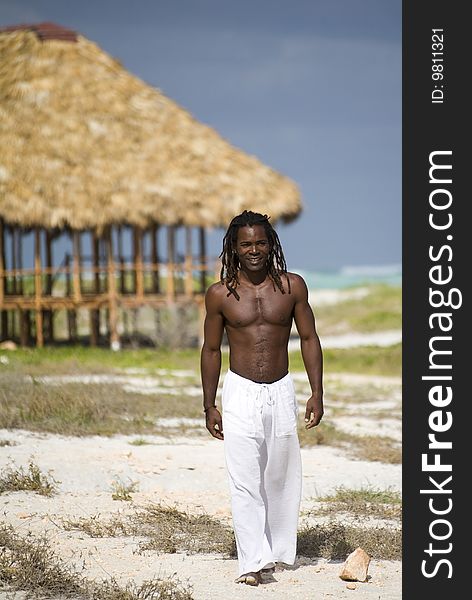 Man Walking On The Beach In Cuba