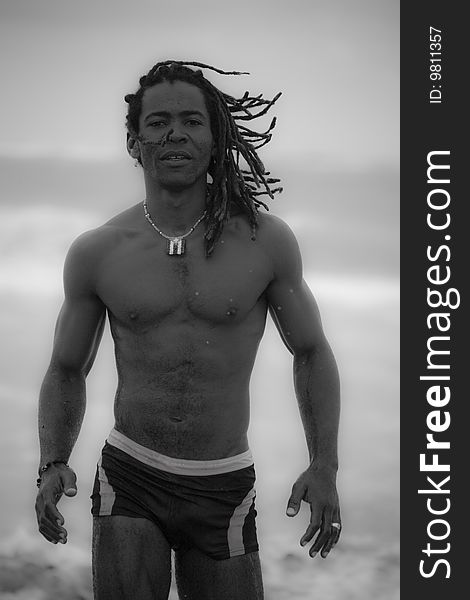 Black man going out the sea black and white picture. Black man going out the sea black and white picture