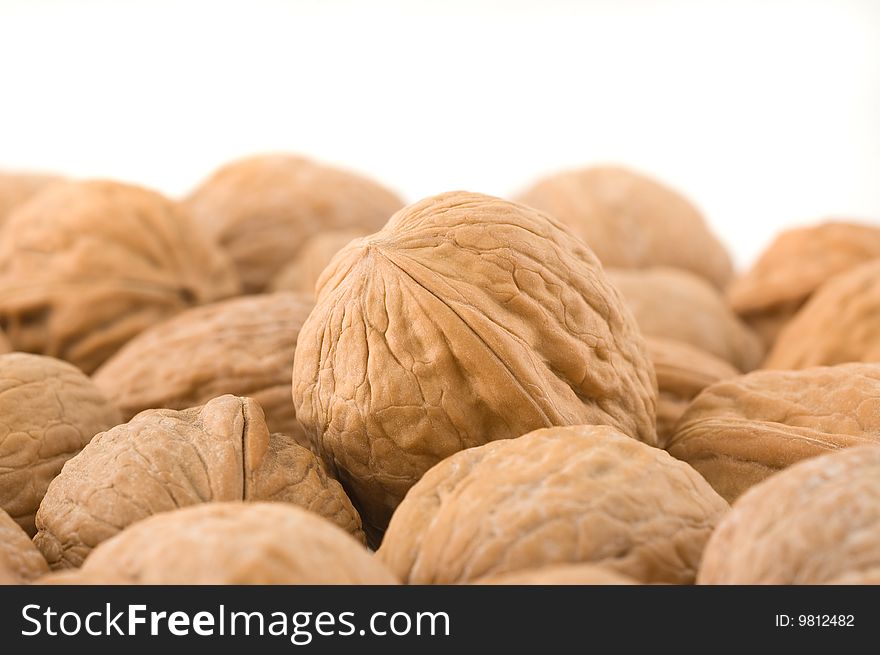 Background of walnuts, close up studio shot. Background of walnuts, close up studio shot.