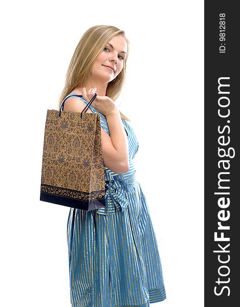 Young pretty girl with bag in blue dress isolated on white