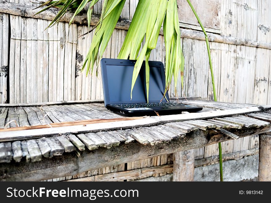 Laptop On A Bamboo Table