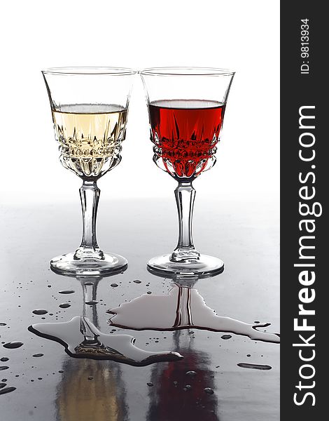 Two glases with white and red wine