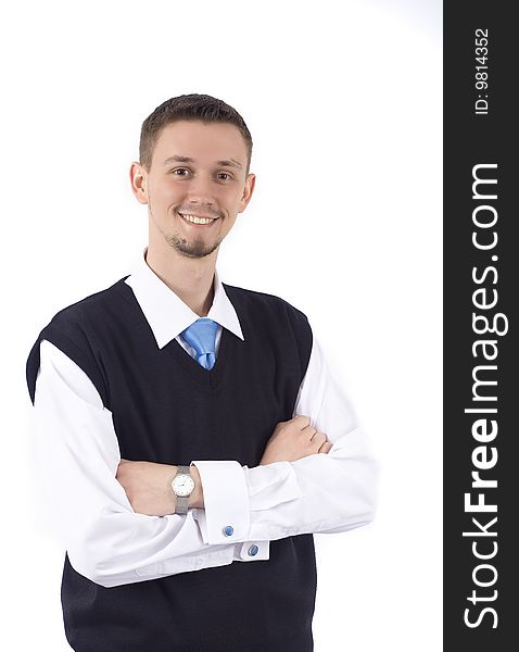 Portrait of a smiling young businessman standing against isolated white background