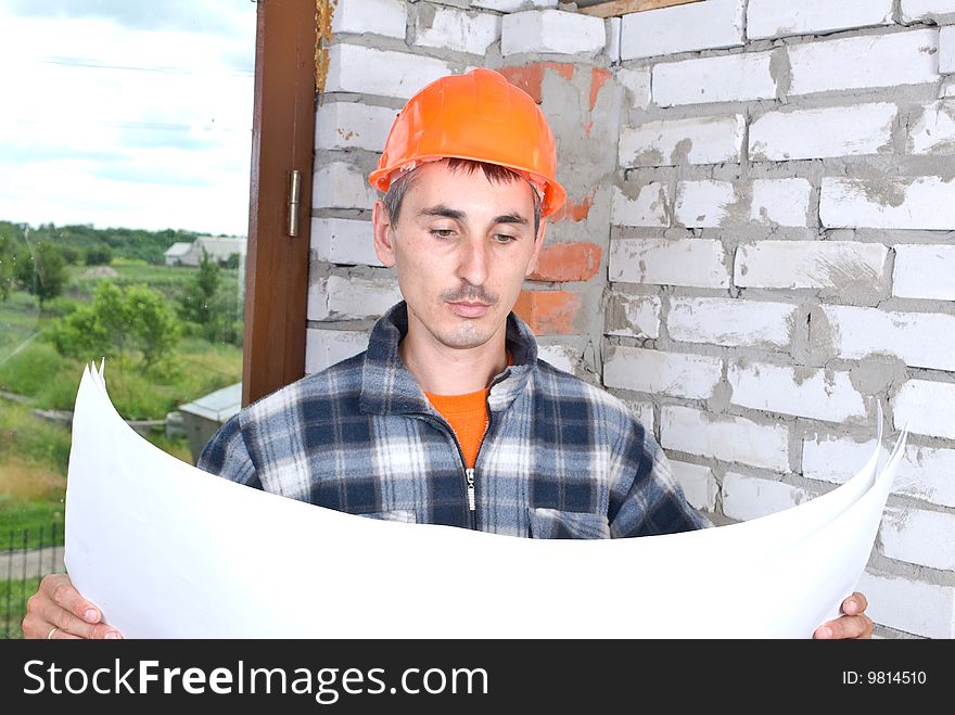 Construction worker  looking on project