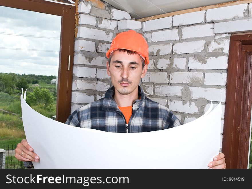Construction worker looking on project