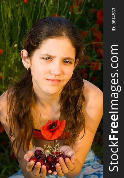 Portrait teen girl with poppy on nature