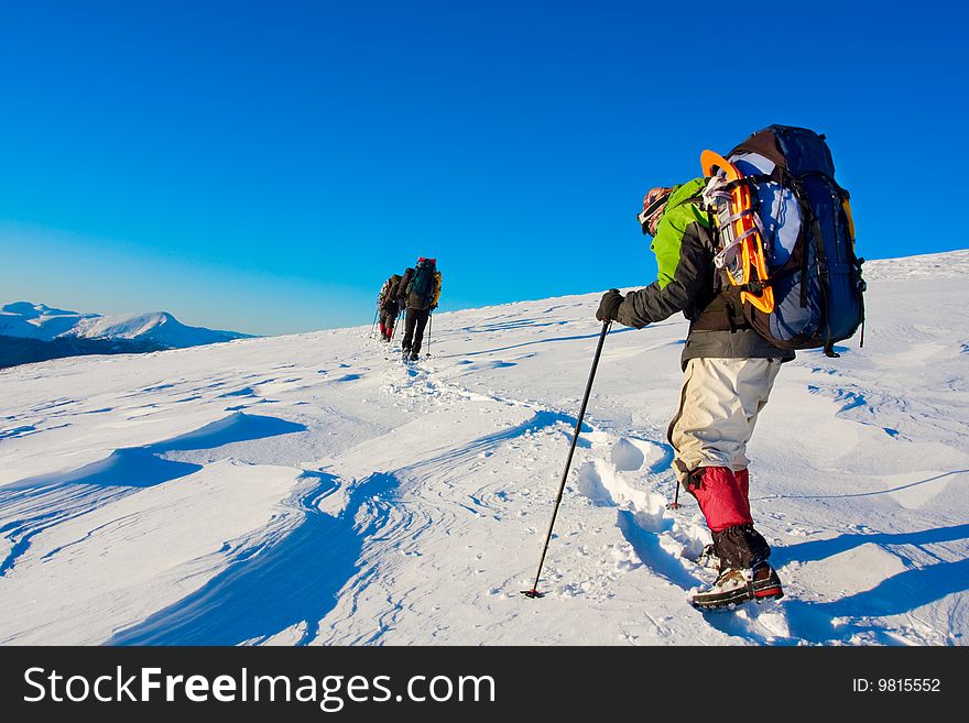 Hiker in high winter mountains