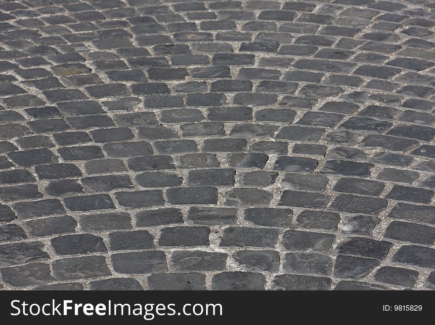 Old medieval granite cobble road