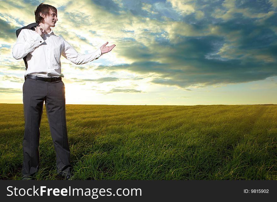 Young  business man show hand in field