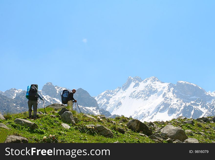 Hikers family  in Caucasus mountains