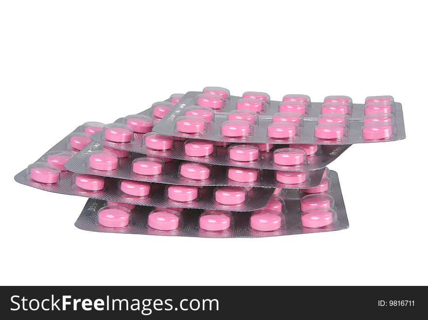 Pile of packings with tablets on a white background