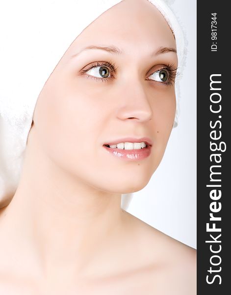 Young girl after bath with towel on her head