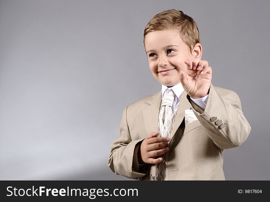 Portrait of a boy showing with his fingers. Portrait of a boy showing with his fingers