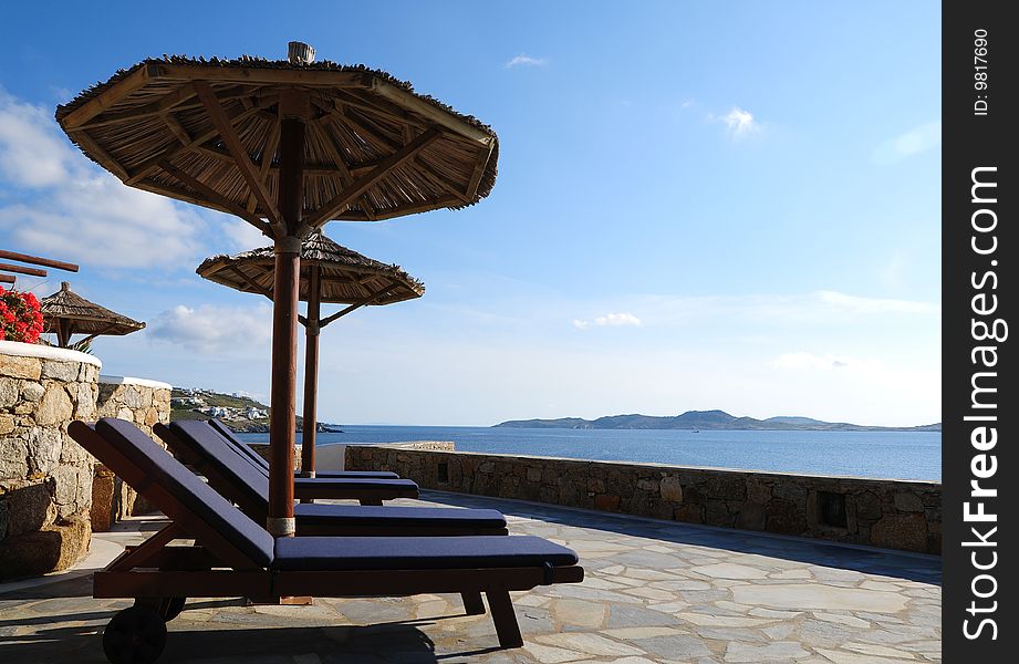 Beach chair and umbrella on the beach