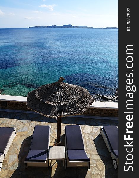 Beach chair and umbrella on the beach