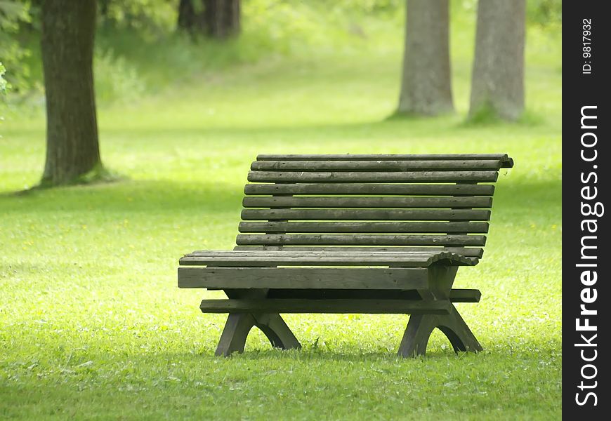 Park bench in a summer park in Finland