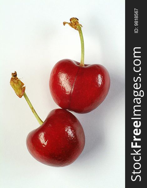 Two ripe red cherries - studio shot