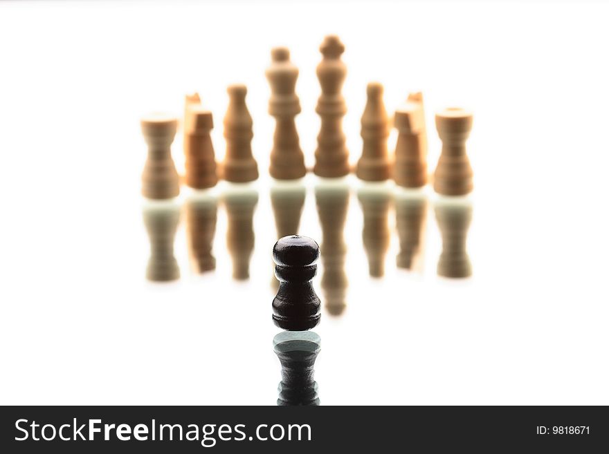 Chess game composition. Black single pawn against white chess army